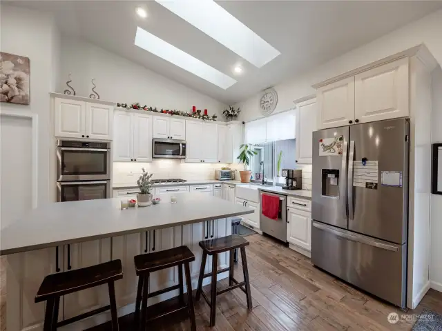 Bright, attractive kitchen with farm sink