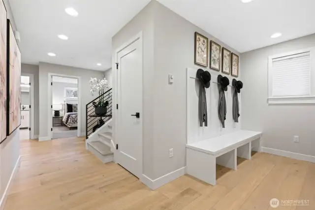 Mud room entrance from the garage is the perfect place to keep all your wet things and offers the perfect space for a second refrigerator!