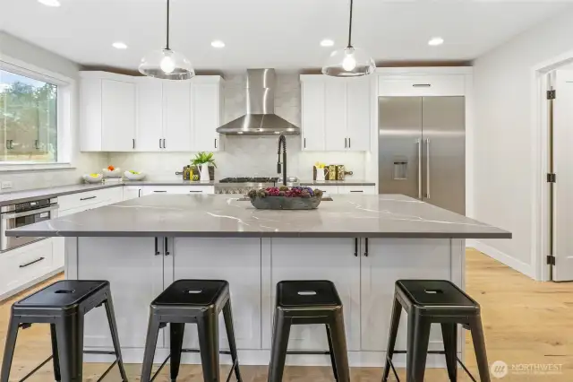 Kitchen island offers plenty of seating for casual meals or entertaining!