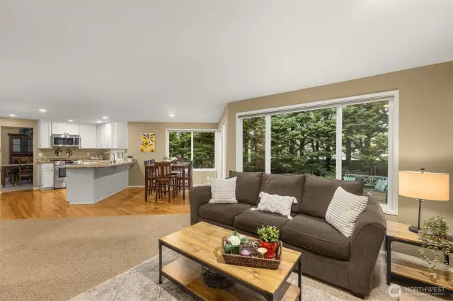 Family Room with Large Window and Woodburning Fireplace