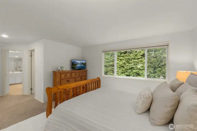 Primary Bedroom with Large Window with view of Backyard