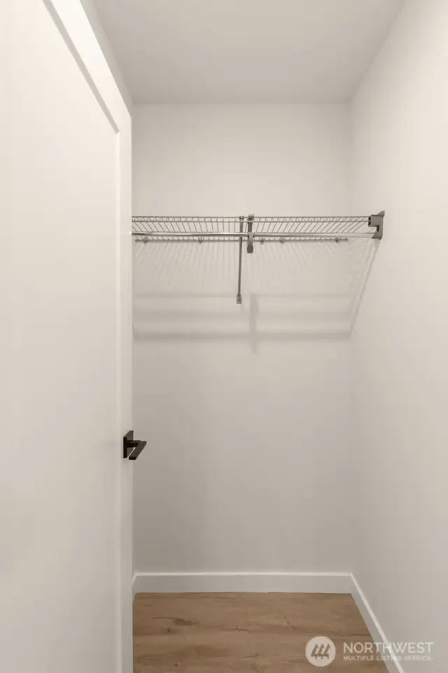 This secondary bedroom is equipped with a walk-in closet that features pre-installed builts in - how convenient!