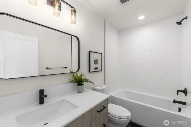Fully equipped ensuite bathrooms feature extended vanities, full tubs with floor to ceiling tile & luxury lighting/hardware packages.