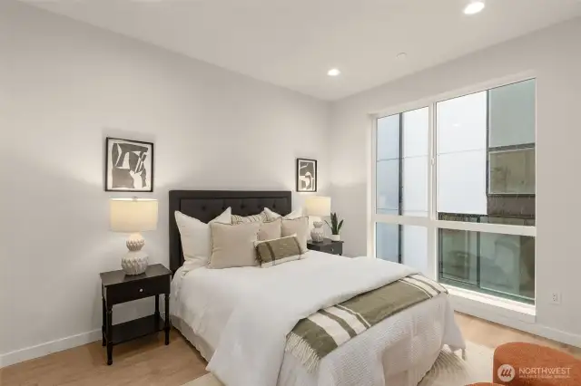 Upstairs, the luxurious primary suite highlights oversized picture windows, vinyl plank hardwood flooring and plenty of storage space in the walk-in closet & connected bathroom!