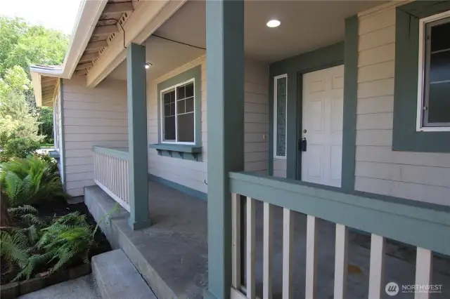 Covered front porch graces the formal entry