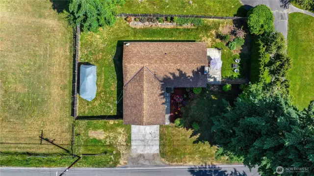 Fully fenced year w/ RV parking west of home.