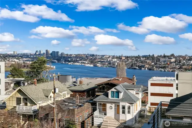 Shift your gaze east and you’ll catch Portage Bay and the UW lights—proof you’re surrounded by the best of city and lake life. Photos are of model home 2009B.