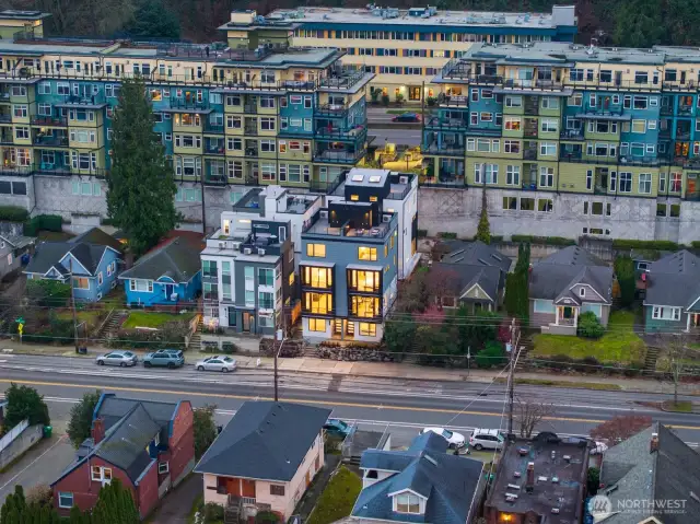From across the boulevard, see how the project blends contemporary architecture with a classic Seattle streetscape. Photos are of model home 2009B.