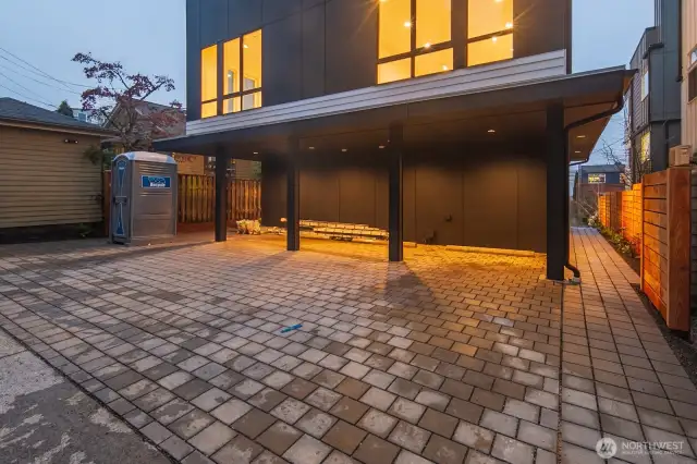 Covered, EV-ready parking means you can plug in overnight and roll out to SLU offices in minutes—rain or shine. Photos are of model home 2009B.