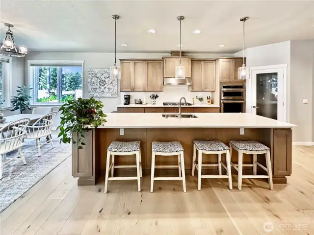 Ample island with seating and walk-in pantry too.