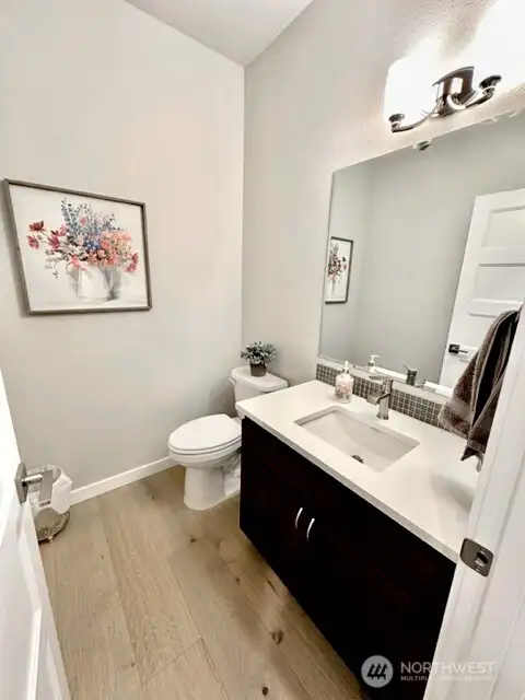 Conveniently located powder room with easy access from kitchen, great room and dining.