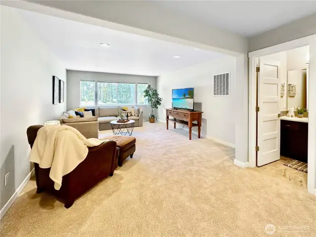 Upper floor features large rec room with golf course views as well as full bath.