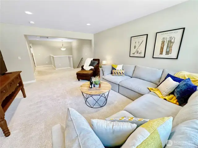 Looking towards stairs and hallway to bonus room from rec room.