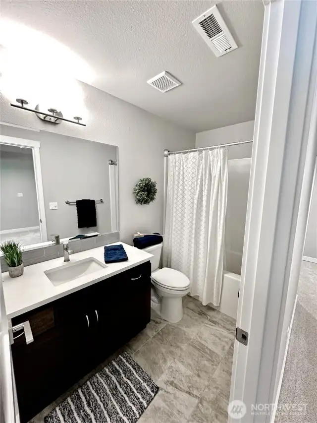 Upper floor full bath.