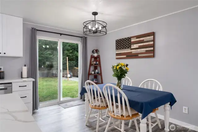 Dining area with slider to backyard.