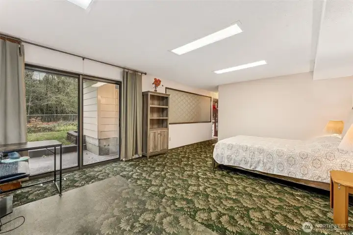 Rec room opens to a patio and fenced yard