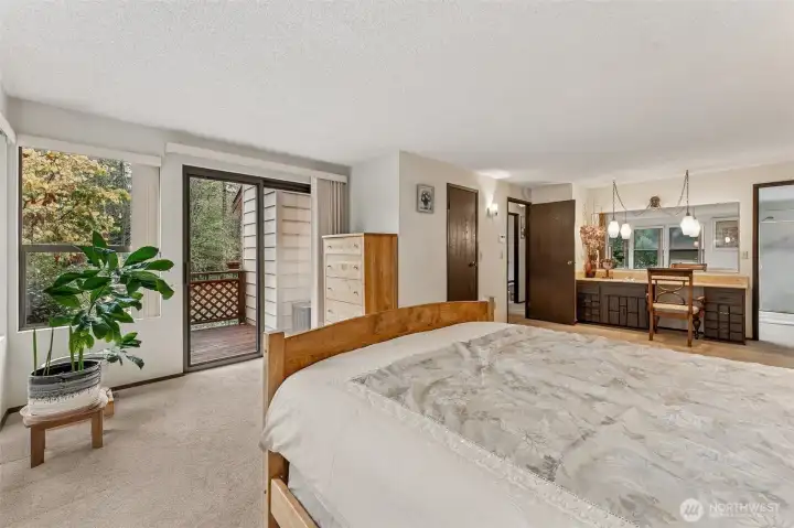 Spacious Primary Suite with private deck, walk-in closet, and gracious beauty station