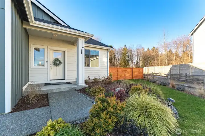 Front entry with clean architectural lines, landscaping, and upgraded exterior finishes.