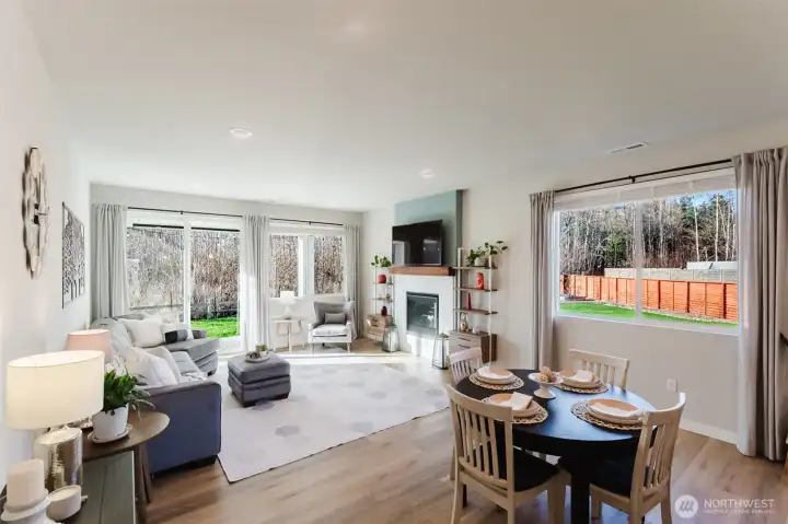 Dining space positioned between kitchen and living areas, ideal for everyday meals or entertaining.