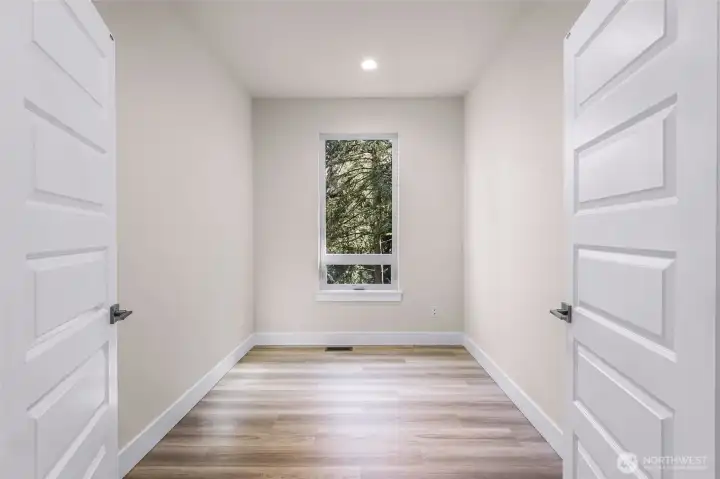 Bright office/flex room with double doors, ideal for home office, guest space, or hobby room