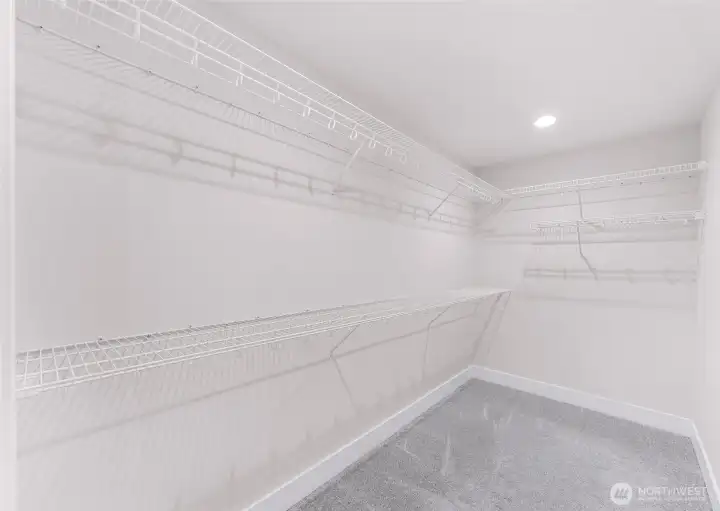 Walk-in closet with built-in shelving for organized storage