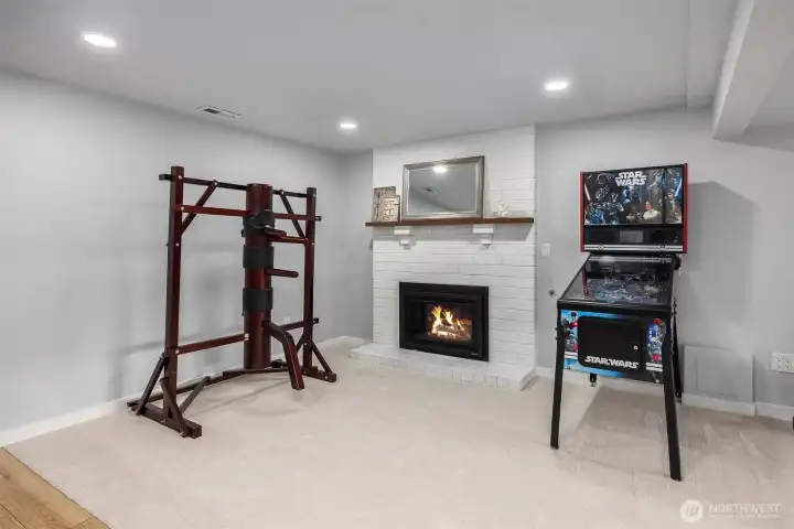 The painted brick fireplace could anchor a second seating space.