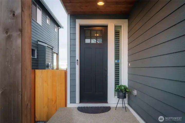 ADT security system includes cameras outside front and back of house.