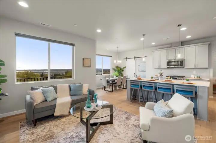 High ceilings and large windows add to the light, airy ambience of the great room.