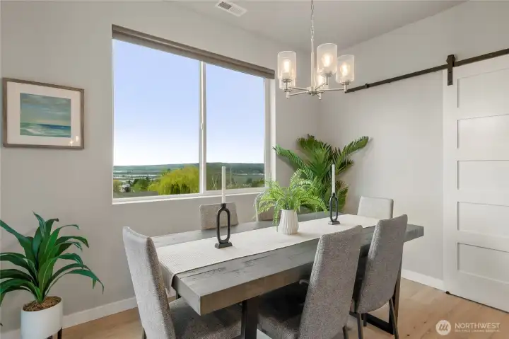 The sliding barn door leads to a small office.