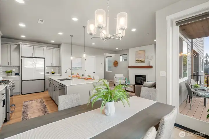 Stainless steel appliances include gas stove, dishwasher, smart fridge, and microwave.