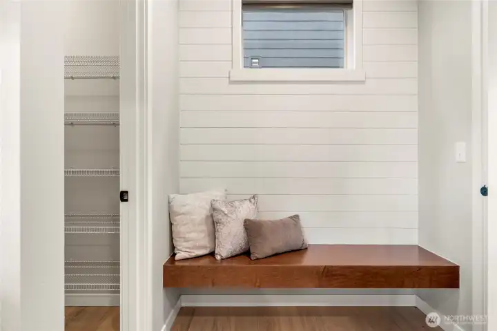 Bench next to garage door at right is perfect for putting on and taking muddy boots.