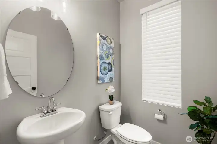 Powder room just off foyer.