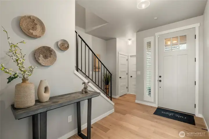 Powder room and linen closet are tucked into the back corner.