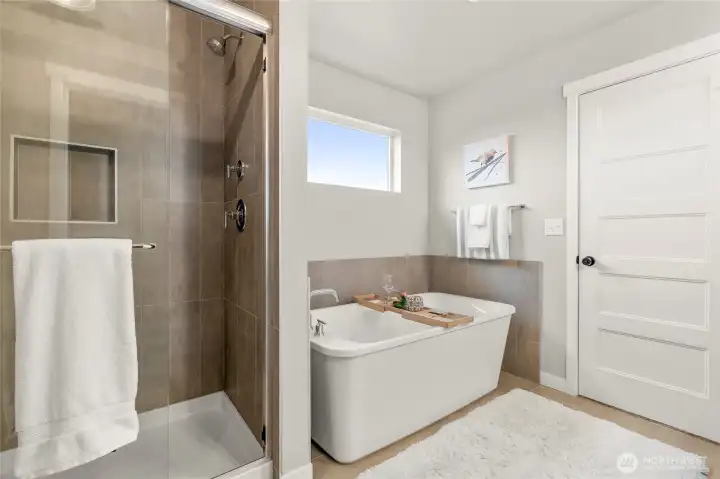 Glass doors and ceramic tiles give shower a sleek look.