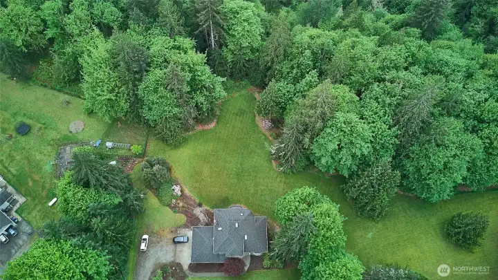 Park like private setting on almost 5 acres That backs to Flaming Geyser state park