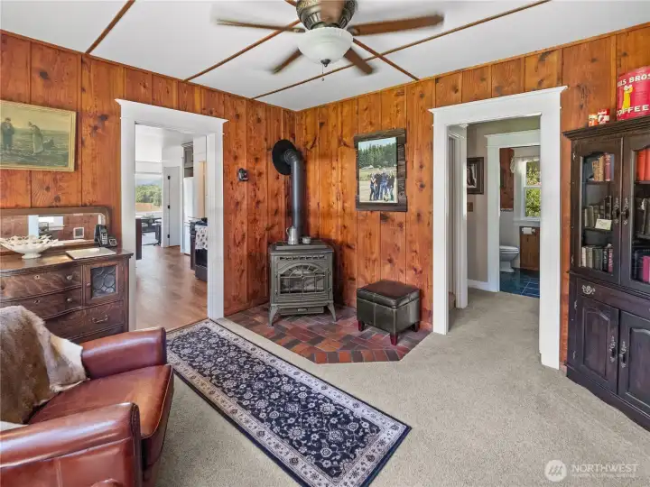 Restored Farmhouse living room with a Quadra-Fire Pellet Stove that is operated by a remote thermostat Restored Farmhouse living room with a Quadra-Fire Pellet Stove that is operated by a remote thermostat