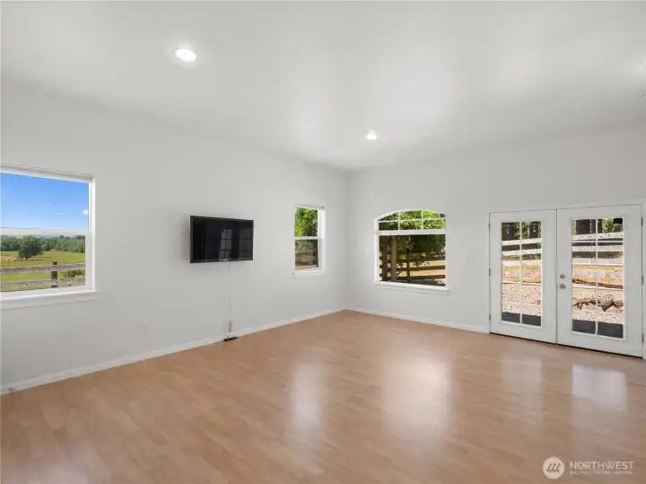 Spacious living room in ADU with french doors leading to private outdoor space Spacious living room in ADU with french doors leading to private outdoor space