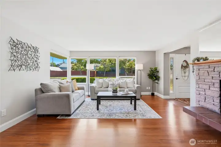 The room offers plenty of space for conversation, entertaining, or quiet mornings with coffee. Views of the beautifully maintained landscaping bring a peaceful outdoor connection inside.