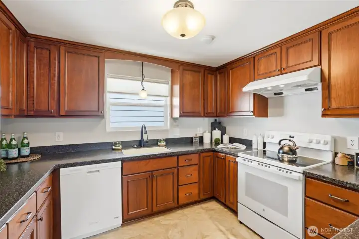 Whether preparing a quick meal or hosting family gatherings, this area is designed for comfortable daily use.