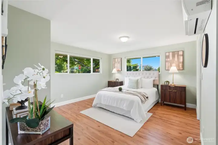 The primary bedroom offers a quiet retreat at the end of the day. Generous proportions provide room for a variety of furniture arrangements.