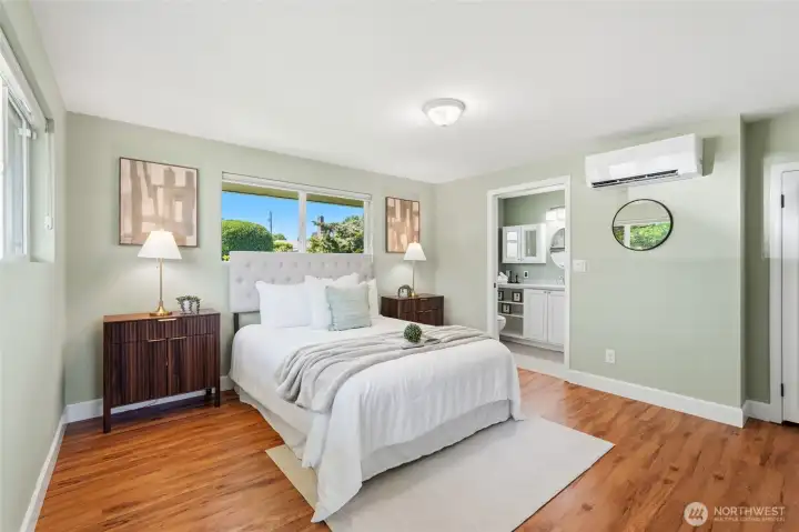 Natural light creates a bright and relaxing atmosphere. The single-level layout makes the bedroom easily accessible and convenient.