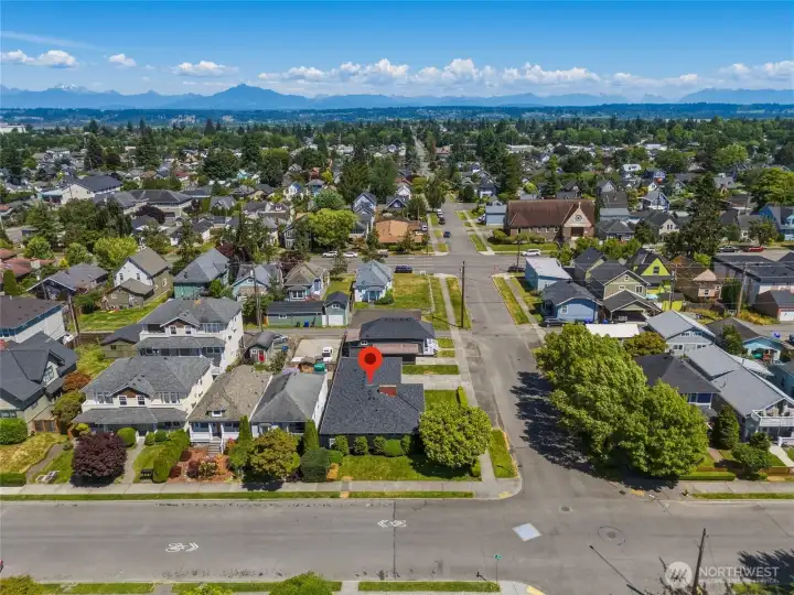 Easy access to the home enhances everyday convenience. The corner-lot setting allows for comfortable maneuverability and curb appeal.
