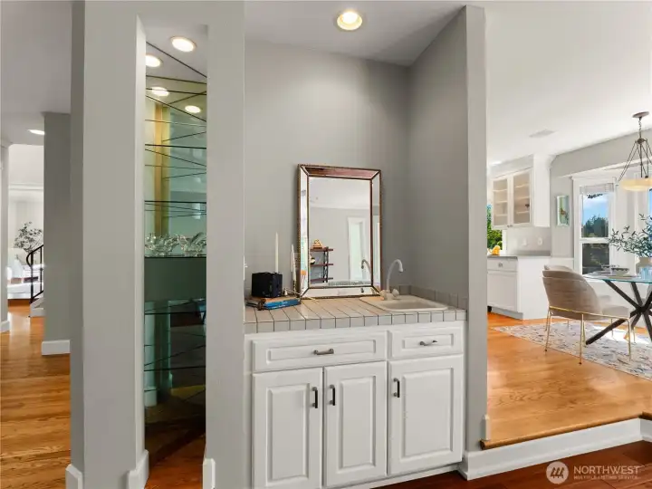 The wet bar is conveniently located in the living room. The wet bar is conveniently located in the living room.