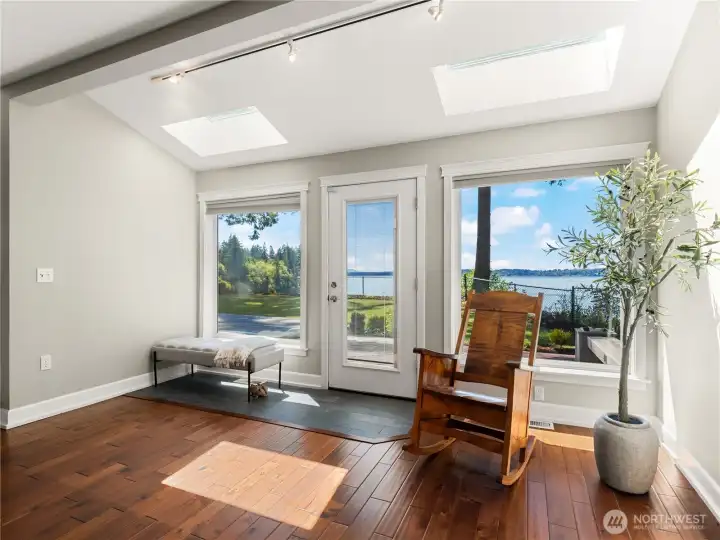 the living room has an exit to the deck. the living room has an exit to the deck.