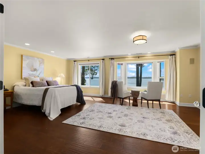 The primary bedroom is over sized and has a nice sitting area to relax with a cup of coffee and a good book. The primary bedroom is over sized and has a nice sitting area to relax with a cup of coffee and a good book.