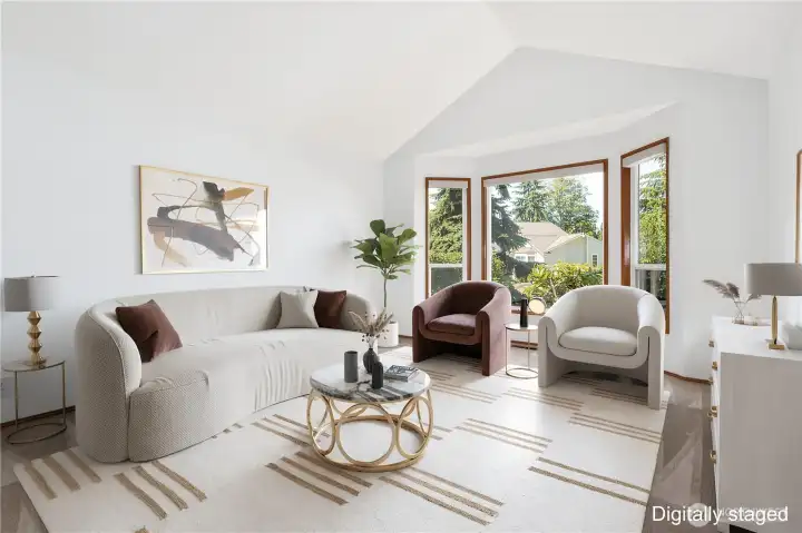 Vaulted ceiling accents the warm & welcoming living room