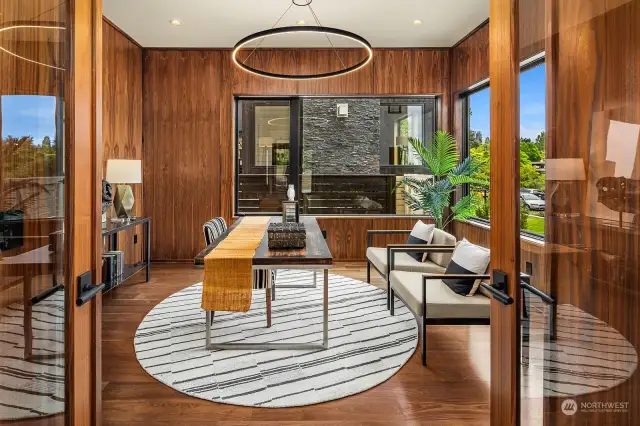 Light filled study is perfectly positioned off the entry to receive visitors without impacting privacy. The space is further enhanced with walnut wrapped walls and views toward to garden.