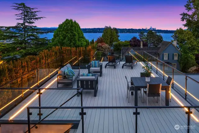 Incredible top of the world roof deck offers unobstructed views, white stained composite decking, LED lighting, and drip irrigation system.