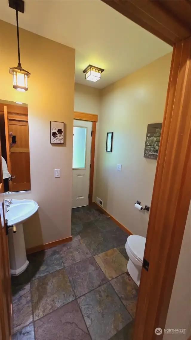 Guest bath on the main floor with access to the covered back deck and patio. No need to walk through the home to wash the s'more stickiness off your hands when your gathered around the back yard firepit, easy access, no messy footprints through the house.