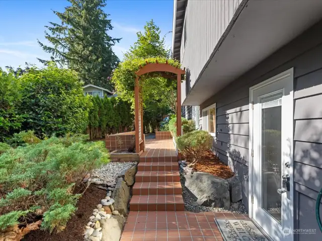 Entry walk from drive w/ side access to garage - ideal for MIL suite potential on lower level.